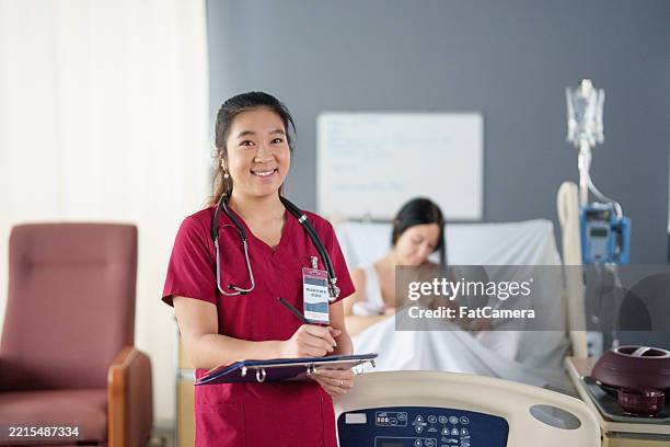 charting pediatric care - nurse charting stock pictures, royalty-free photos & images