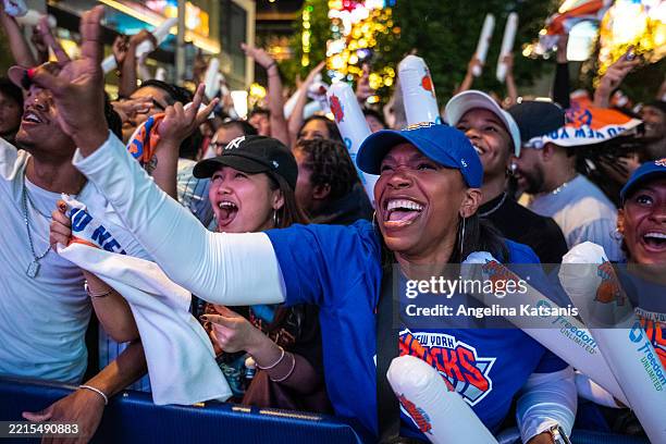 Kim Garcia cheers for a New York Knicks' three-pointer in the first quarter of Game Six of the Eastern Conference Second Round NBA Playoffs against...