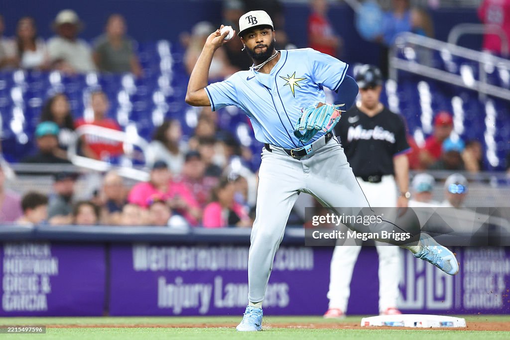 Miami Rays Junior Caminero of the Tampa Bay Rays throws the ball to first base ...