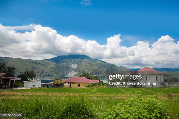 mt. pusuk buhit the volcano in the lake toba - toba volcano stock pictures, royalty-free photos & images
