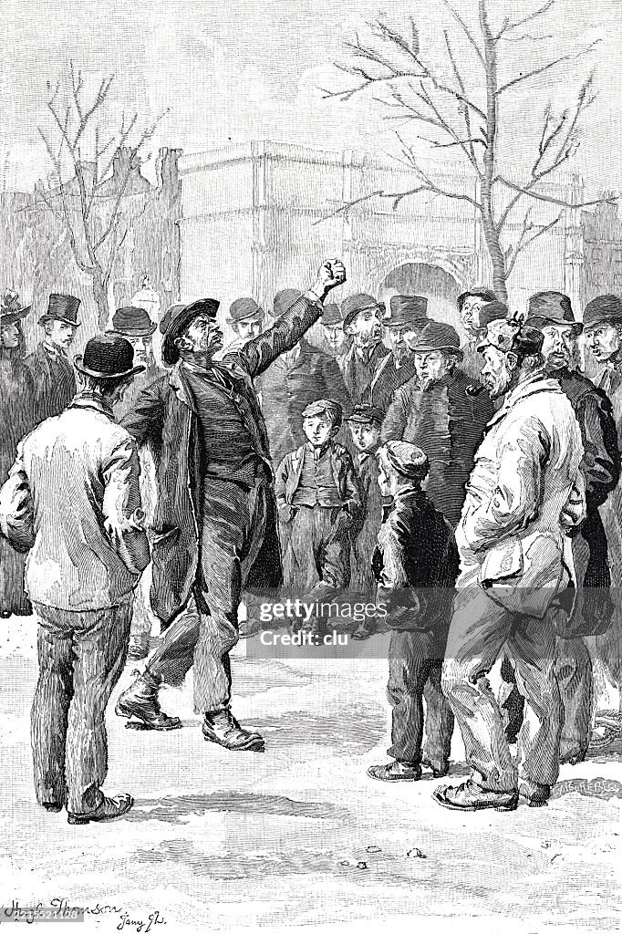 Hyde Park London, gathering of socialists, in the middle a man with a raised fist gives a combative speech