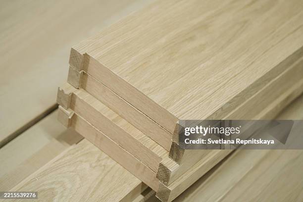 stack of finger-jointed solid wood planks in workshop - holzstapel stock-fotos und bilder