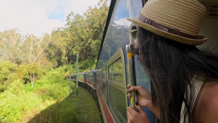 https://media.gettyimages.com/id/2215553208/video/happy-passenger-woman-tourist-stand-by-doorstep-enjoy-popular-train-ride-journey-kandy-to.jpg?b=1&s=640x640&k=20&c=BGh-OiH-MtsnIDWK9Ttnkb4uzAddOWrHxqW8iy7u1Q4=