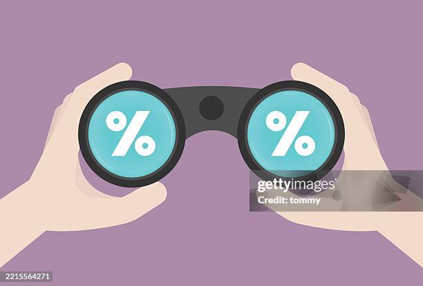 percentage symbol with binoculars for interest rate concept - interest rate stock illustrations