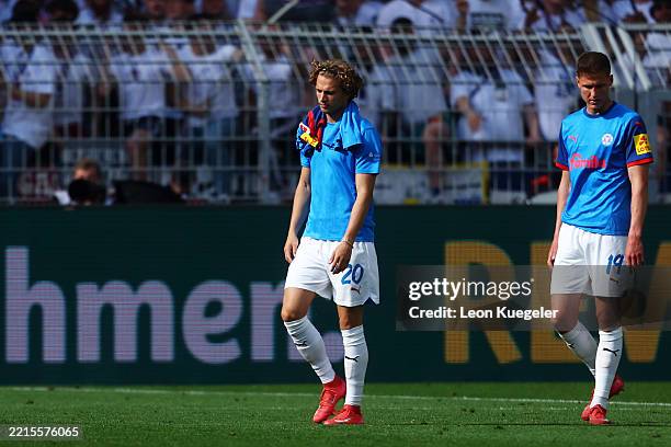 Jann-Fiete Arp and Phil Harres of Holstein Kiel react following full-time in the Bundesliga match between Borussia Dortmund and Holstein Kiel at...