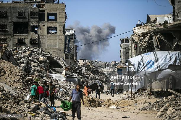 Palestinians in the Jabalia refugee camp leave their homes and move to areas they believe to be safer, carrying with them only the belongings they...