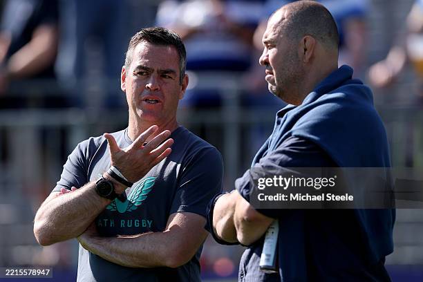 Johann van Graan, Head Coach of Bath Rugby, speaks with Michael Cheika, Head Coach of Leicester Tigers, prior to the Gallagher Premiership Rugby...