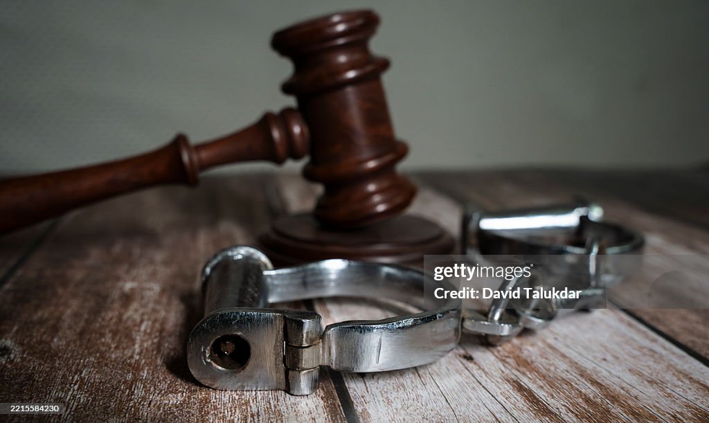 A justice gravel and handcuffs