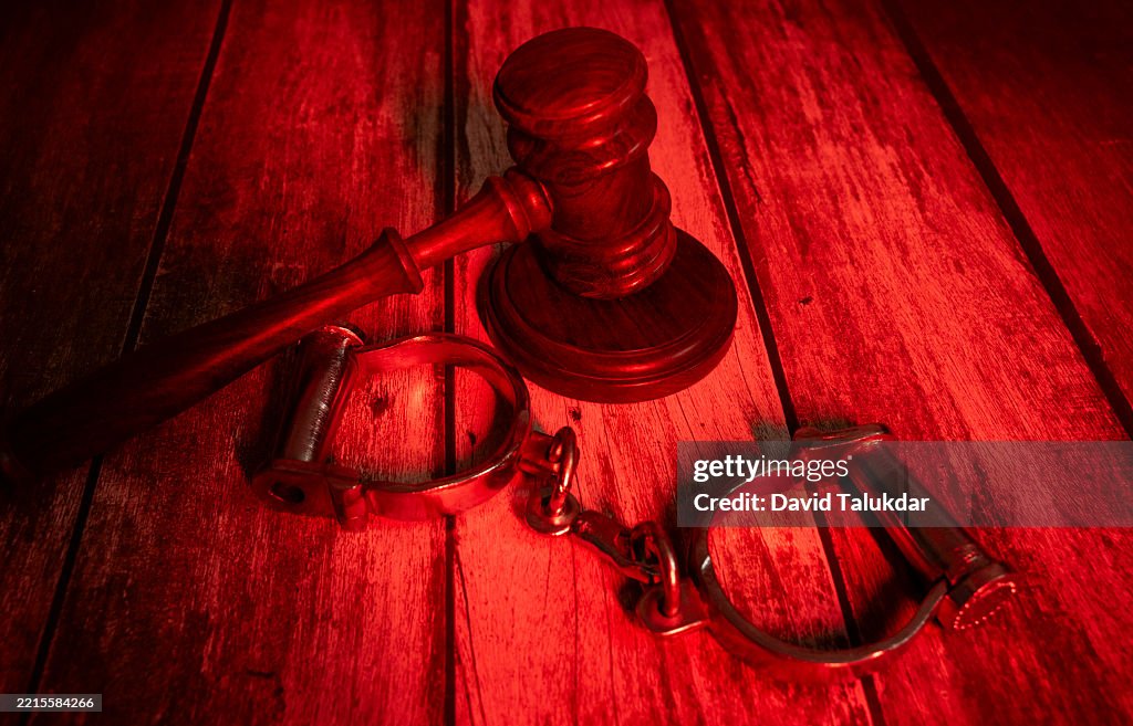A justice gravel and handcuffs