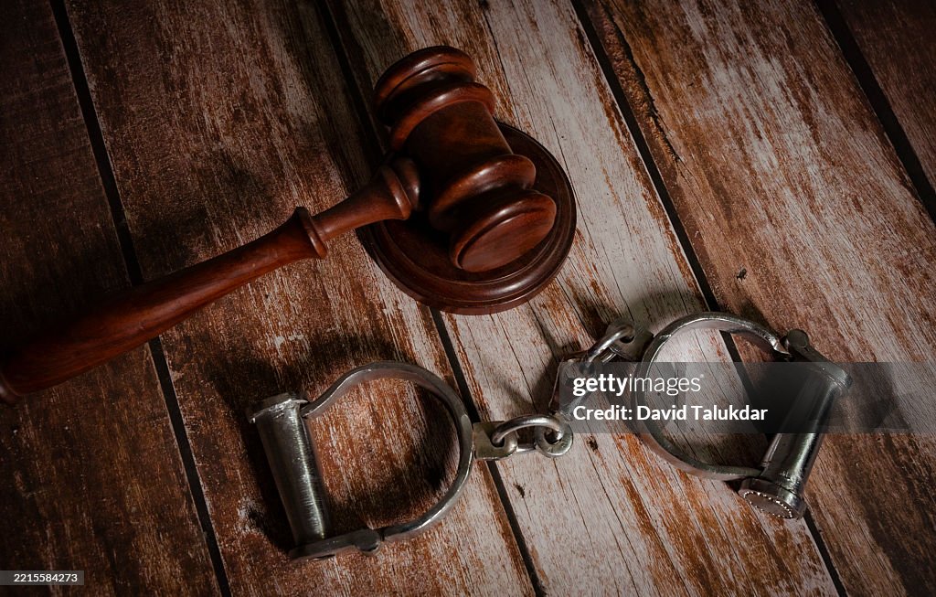 A justice gravel and handcuffs