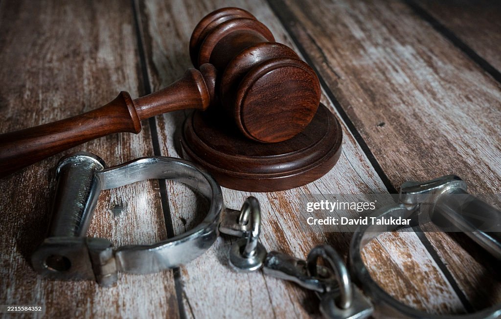 A justice gravel and handcuffs