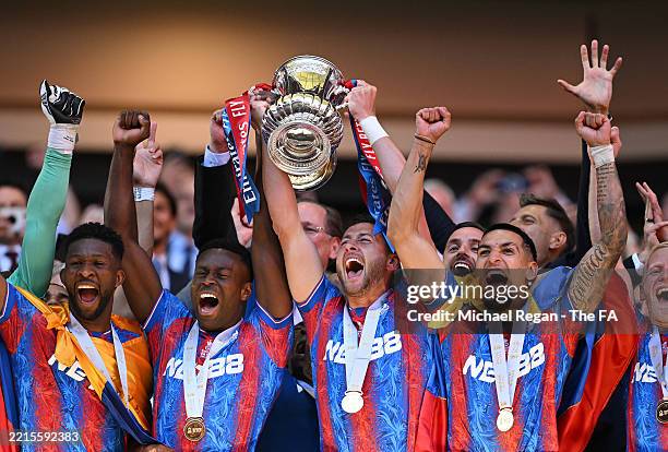 Marc Guehi and Joel Ward of Crystal Palace lifts the FA Cup trophy after his team's victory in the Emirates FA Cup Final match between Crystal Palace...