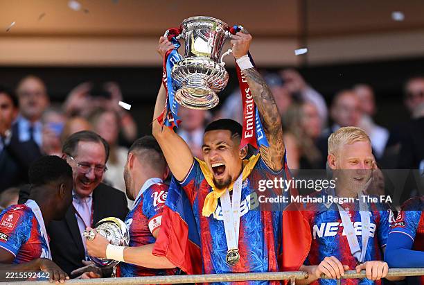 Daniel Munoz of Crystal Palace lifts the FA Cup trophy after their team's victory in the Emirates FA Cup Final match between Crystal Palace and...
