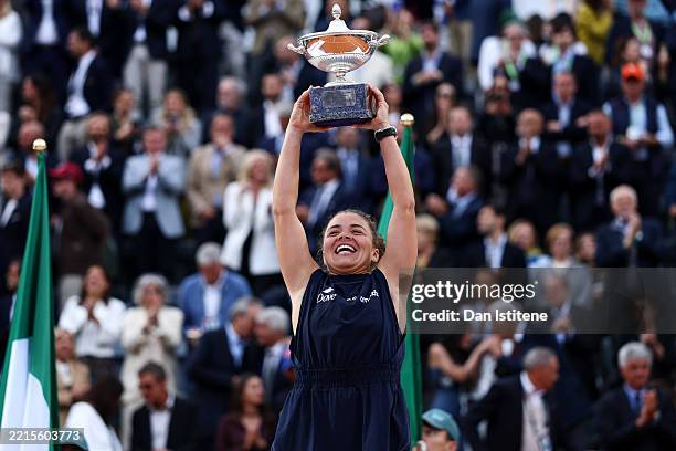 Jasmine Paolini of Italy celebrates with the trophy following victory against Coco Gauff of United States in the the Women's Singles Final match on...