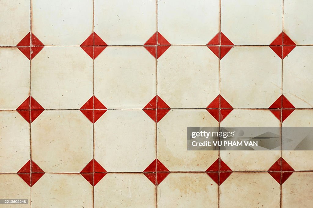 Vintage style tile floor with red square shapes