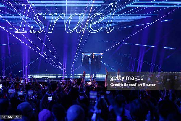 Yuval Raphael representing Israel walks on stage during the Grand Final of the 69th Eurovision Song Contest Opening Ceremony at St. Jakobshalle on...
