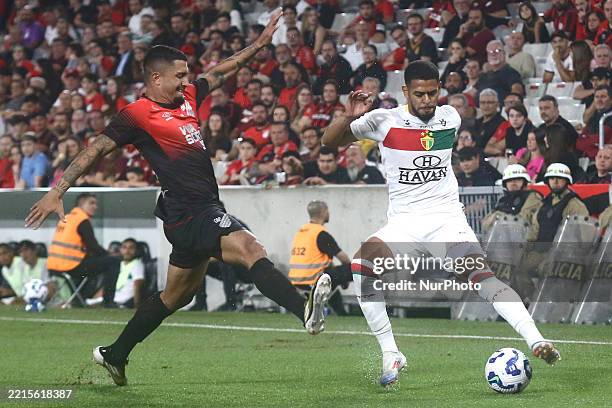 Renan Peixoto from ATHLETICO-PR contends with Talo from BRUSQUE during the Brazilian Cup Third Round - Second Leg match at ARENA DA BAIXADA stadium...