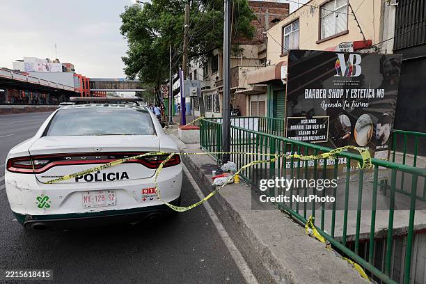 Police secure the area where Ximena Guzman, a private secretary, and Jose Munoz, a private advisor, high-level members of the cabinet of Clara...