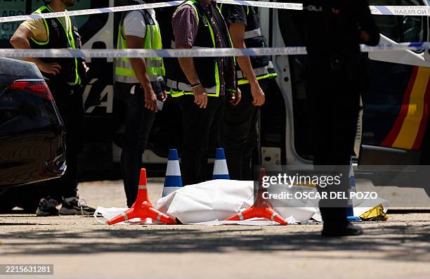 Picture taken on May 21, 2025 shows the body of ex-Ukraine MP Andrey Portnov after he was shot dead in front of his children school in Pozuelo de...