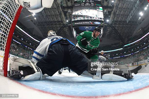Mikko Rantanen of the Dallas Stars takes a shot on Connor Hellebuyck of the Winnipeg Jets during the third period in Game Six of the Second Round of...