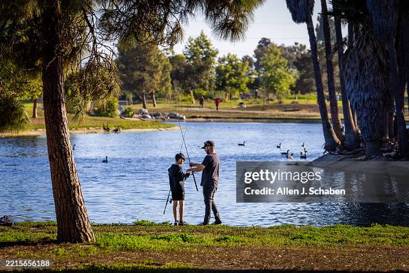 Michael Errin Rios Michael Rios, of Long Beach, spends time fishing with his son,... News ...