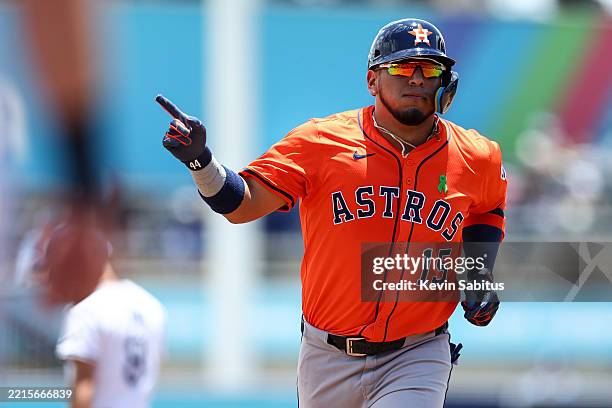 Isaac Paredes of the Houston Astros celebrates while rounding the bases after hitting a two-run home run during the first inning of a game against...