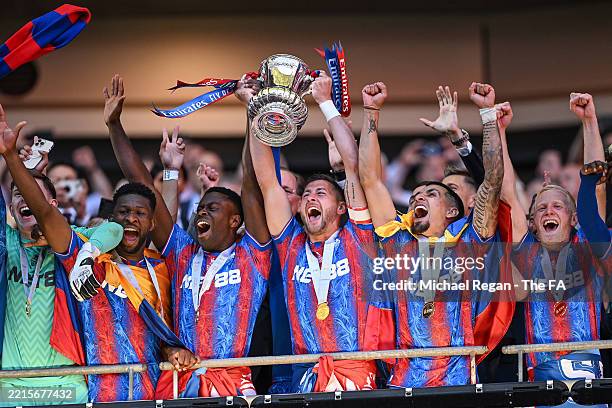 Joel Ward of Crystal Palace lifts the FA Cup trophy after his team's victory in the Emirates FA Cup Final match between Crystal Palace and Manchester...