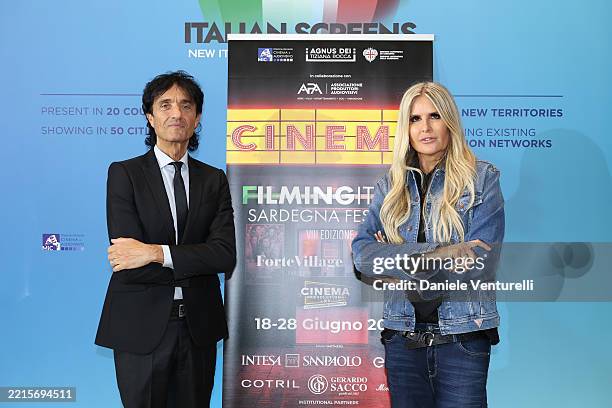Giulio Base and Tiziana Rocca pose during the Filming Italy Sardegna Press Conference at the 78th annual Cannes Film Festival at Majestic Hotel on...