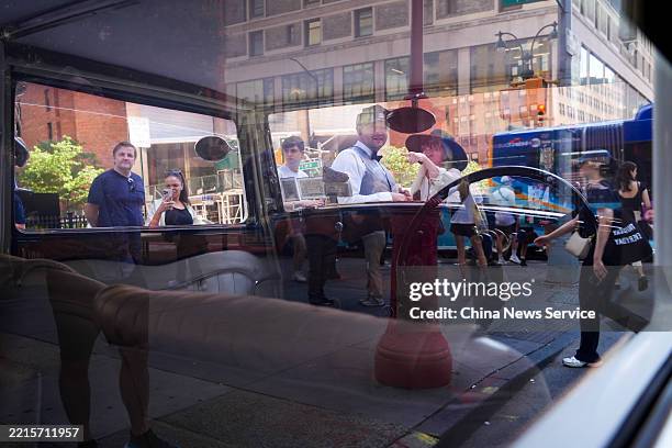 People view Rolls-Royce vintage car during Park Avenue Day 2025 in Manhattan on May 17, 2025 in New York City.