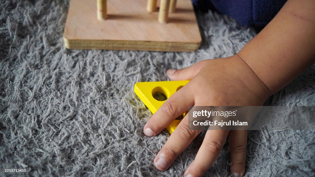Toddler playing with educational toys
