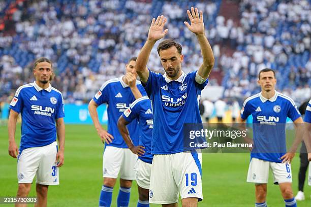 Kenan Karaman of FC Schalke 04 acknowledges the fans at full-time following his side's defeat in the Second Bundesliga match between FC Schalke 04...