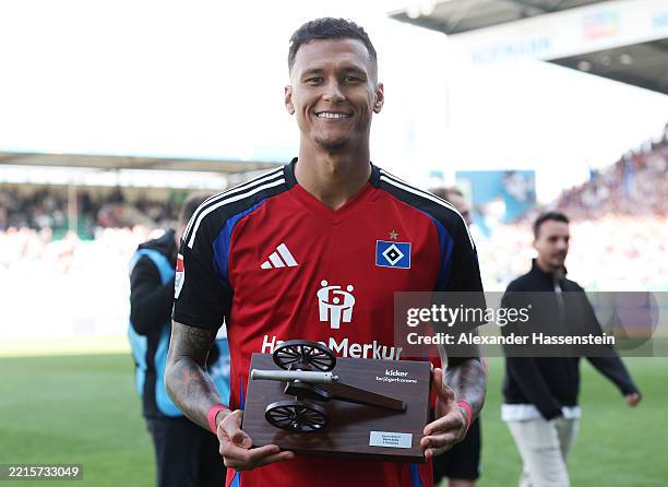 Davie Selke of Hamburger SV poses for a photo with the trophy for the Second Bundesliga's top goalscorer following the Second Bundesliga match...