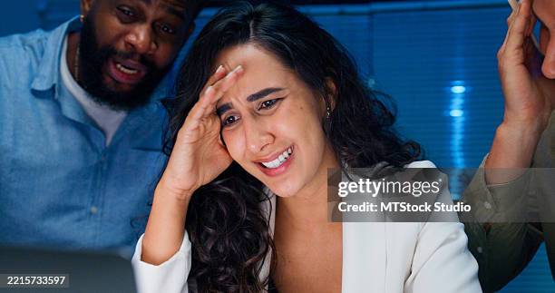 closeup group of business professionals working late experiencing frustration and stress while discussing financial challenges and strategy during a crisis at office night. finance meeting. - topics stock pictures, royalty-free photos & images