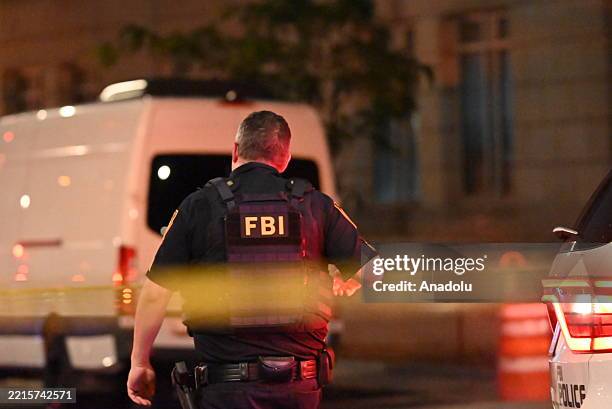 Agents work at the crime scene where two Israeli Embassy Staff Members were killed as they were outside an event at the Capital Jewish Museum in...