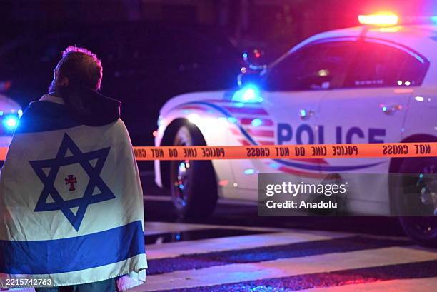 Agents work at the crime scene where two Israeli Embassy Staff Members were killed as they were outside an event at the Capital Jewish Museum in...