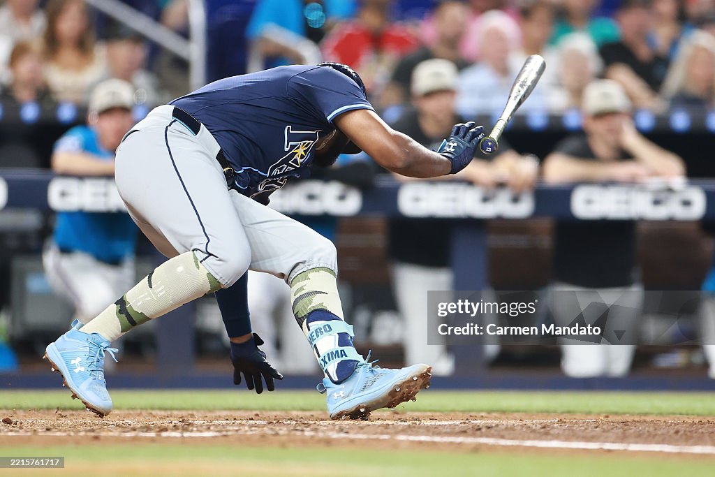 Miami Rays Junior Caminero of the Tampa Bay Rays avoids being hit by a pitch ...