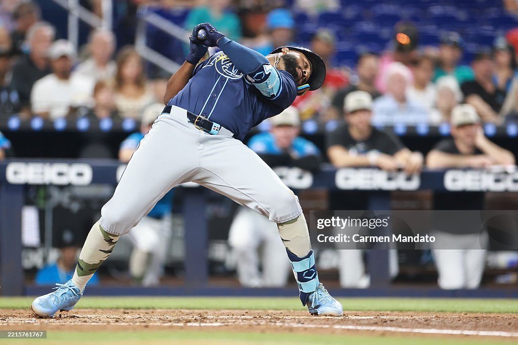 Miami Rays Junior Caminero of the Tampa Bay Rays avoids being hit by a pitch ...