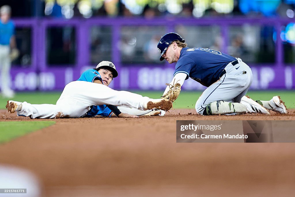 Miami Rays Javier Sanoja of the Miami Marlins unable to tag out Taylor Walls of ...