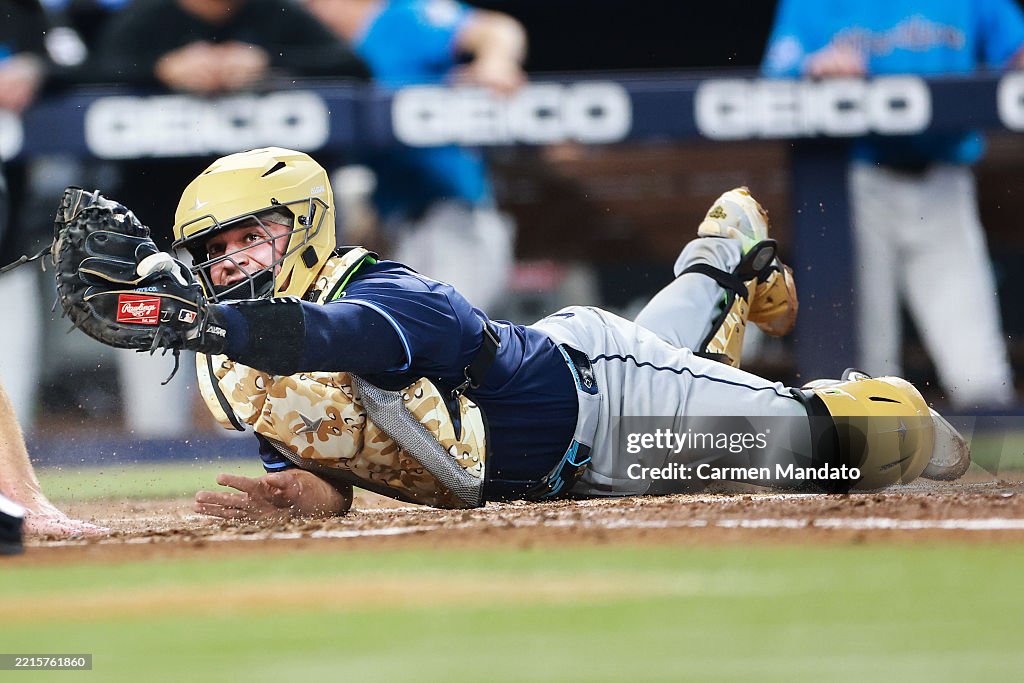 Miami Rays Eric Wagaman of the Miami Marlins is tagged out by Ben Rortvedt of ...