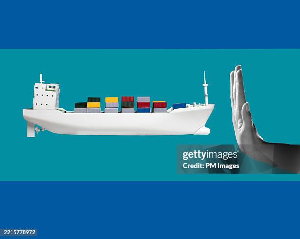 international trade obstacle / container ship and hand - trade war stock pictures, royalty-free photos & images