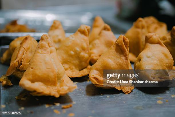 golden fried samosas – traditional indian snack food - samosa stock pictures, royalty-free photos & images