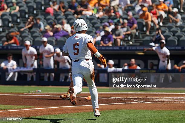 Texas infielder Ethan Mendoza runs towards home to score a run during the SEC Softball Tournament Quarterfinals game between Texas Longhorns and...