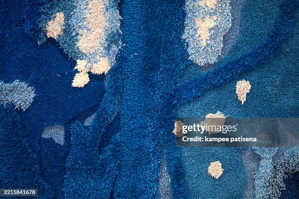 full frame shot of abstract blue and navy rug carpet pattern textured background - ruffled feathers stock pictures, royalty-free photos & images