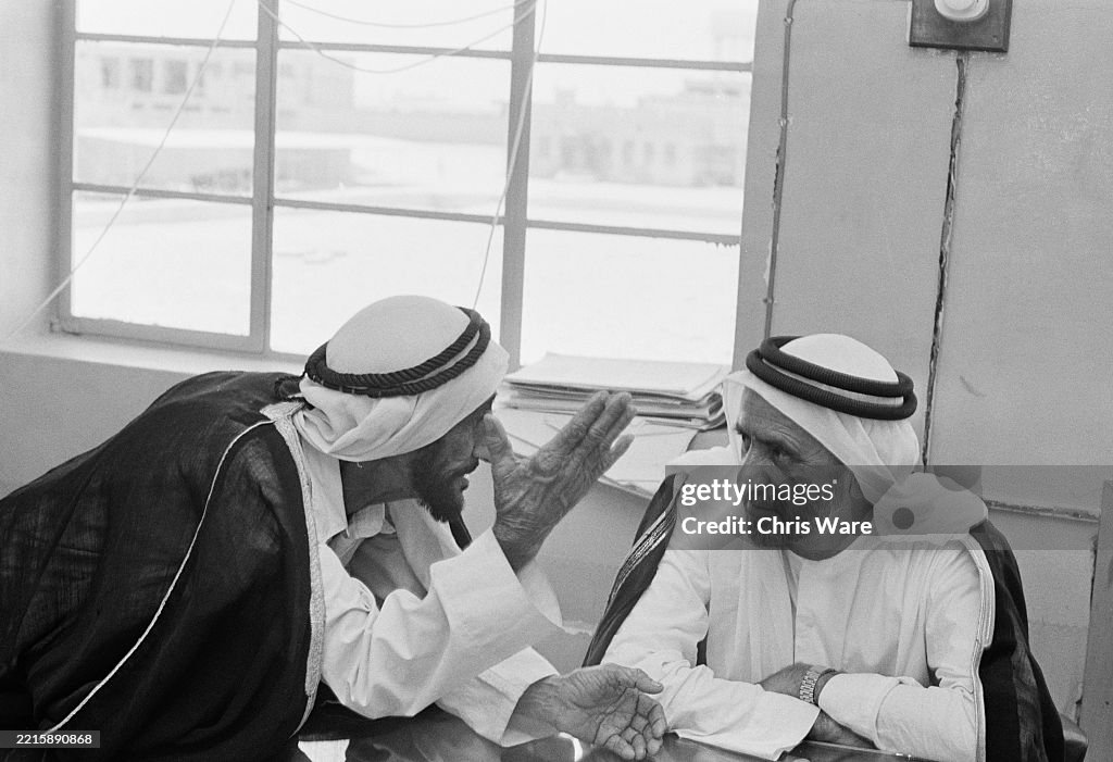First Uae Ruler Sheikh Rashid bin Saeed Al Maktoum , Ruler of Dubai, conferring with ...