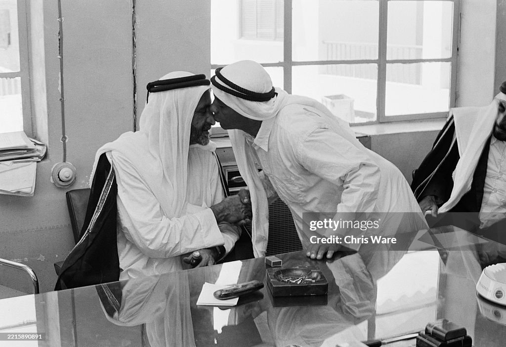 First Uae Ruler Sheikh Rashid bin Saeed Al Maktoum , Ruler of Dubai, greets a visitor ...