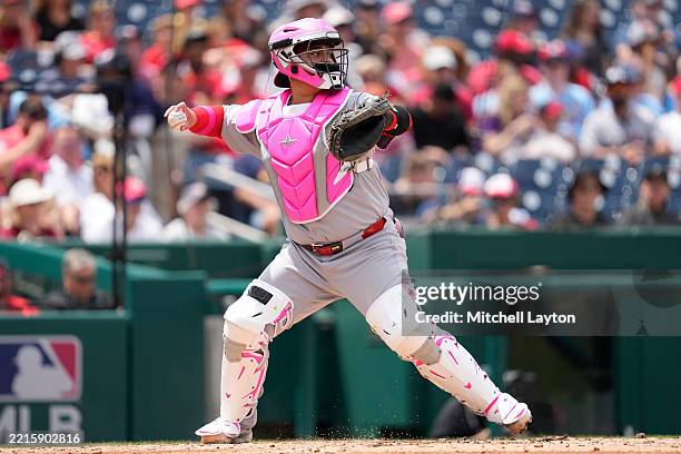 Yohel Pozo of the St. Louis Cardinals looks to throw to second base during a baseball game against the Washington Nationals at Nationals Park on May...