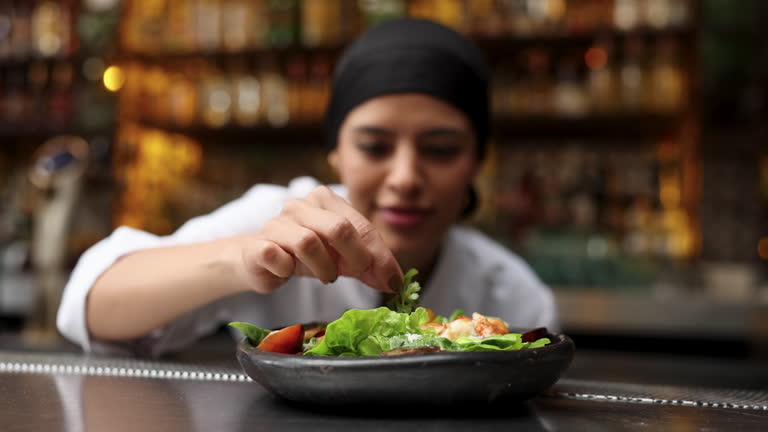https://media.gettyimages.com/id/2215925774/video/female-chef-adding-a-decoration-to-a-mexican-dish-at-the-restaurant.jpg?b=1&s=640x640&k=20&c=EfVJ293Y4tkewldQ9AmMnk-95TpuFCh2fdJ--gGJGSE=