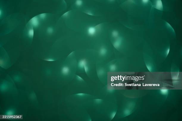 abstract green background featuring ethereal light flows and organic patterns - ambient light stock pictures, royalty-free photos & images