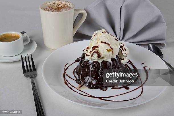 lava cake with cappuccino and espresso - chocolate lava stock pictures, royalty-free photos & images