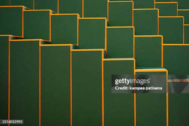 a green wall with orange stripes - rainbow drawing wall stock pictures, royalty-free photos & images